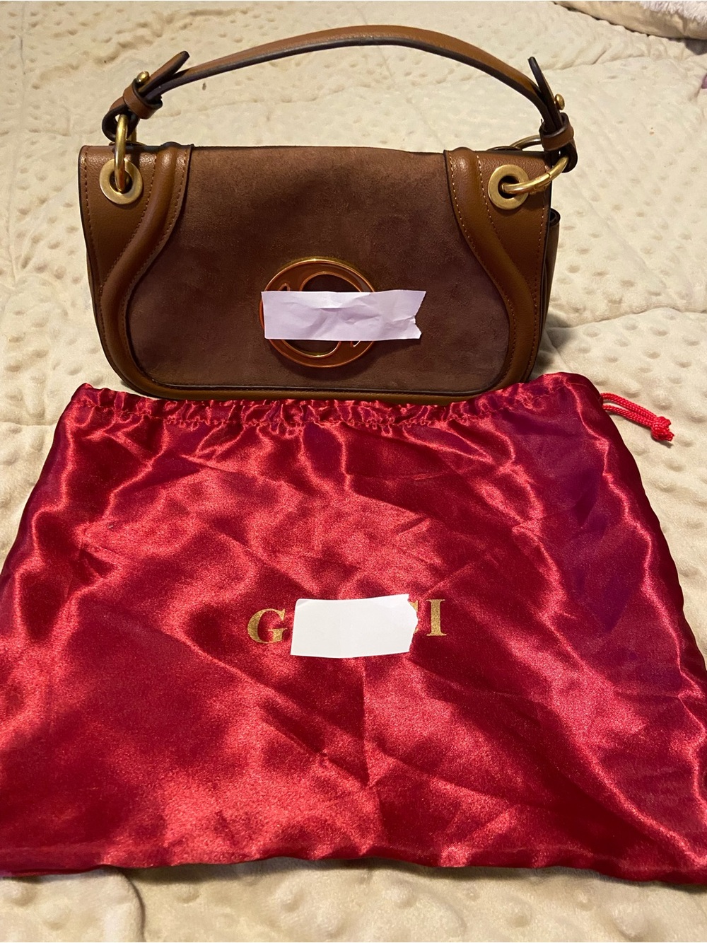 NWOT
Brown Suede and Leather handbag with gold hardware and accent .